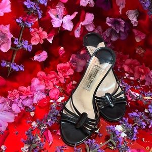 Jimmy Choo black high heels.